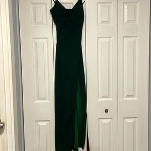 Beautiful emerald green dress with slit and a tied top